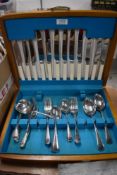 A Canteen of vintage stainless steel cutlery, including boned handled knives.