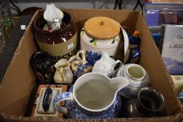 A Laura Ashley blue and white water jug, a selection of milk jugs, a salt glazed style biscuit jar