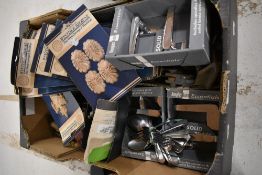 A mixed lot of hardware including vintage cutlery, door handles, decorative wood mouldings and