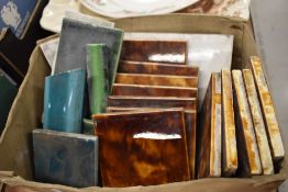 A selection of miscellaneous ceramic tiles, mainly mottled brown/treacle glaze, marked MAWCO to