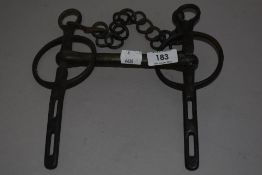A cast-metal horse bit