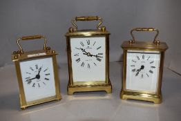 Three modern brass cased carriage clocks including Junghans and two by Estyma