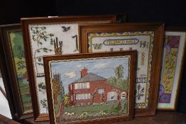 A group of five modern framed embroideries and samplers