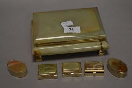 A large vintage gilt metal and onyx dressing table/jewellery box, sold along with five smaller