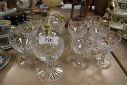 A pair of Cumbrian crystal globular burners, sold together with ten glasses