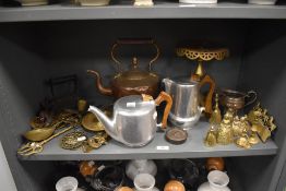 A selection of hardware including Picquot ware, copper kettle, brass trivet and brass ornaments