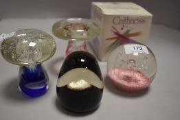 Two Caithness glass paperweights sold along with two mushroom form bubbled glass paperweights