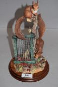 A Border Fine Arts 'Autumn Reds' red squirrel study, number B0779, on turned mahogany plinth base
