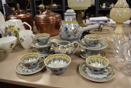 A Portuguese pottery coffee set, with foliate decoration, chip to one cup