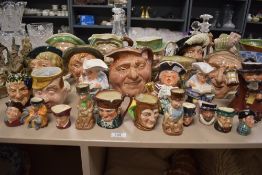 Twenty seven character jugs of varying size and subject, mainly Royal Doulton