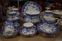 A Royal Crown Derby part tea service, transfer printed with foliate swags and diaper borders, teal