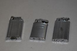 Three early 20th century cigarette lighters including Polo and two by Ronson