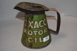 A vintage metal Texaco Motor oil jug, used with some corrosion showing