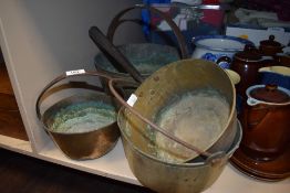 A vintage brass jam pan, toffee pan and two smaller preserve pans