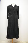 A 1930s bias cut patterned crepe dress having lovely Art Deco details throughout, turn up cuffs