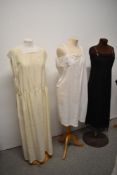 Two early 20th century petticoats and a silk nightdress with the letter 'R' monogrammed to front