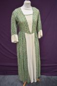 A Vintage handmade dress of vibrant patterned cotton having hook and eye fastening to back.