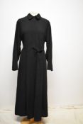 A late 1920s/ early 1930s black chore or day dress having seamed details to bodice and skirt and