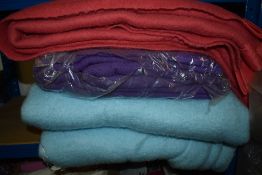 Four colourful vintage blankets.