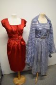 A blue and silver striped late 40s/ early 50s dress with shawl and belt and a 1950s red satin wiggle