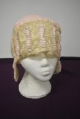 A beautiful 1920s/ 30s wedding cap of pale pink satin with extensive tulle lace and ribbon work.