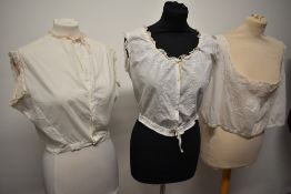 Three Victorian corset covers or camisole tops with pretty details throughout.