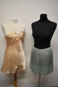 A set of CC41 utility labelled liquid satin cami knickers in pale pink and a pair of CC41 ice blue