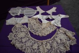 A collection of late 19th and early 20th century collars including intricate lace examples.