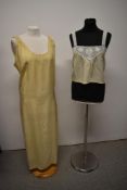 A 1920s silk nightdress in cream having pleats to sides and honeycomb smocking to shoulders, sold