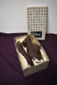 A pair of brown Portland shoes in box with stack heel, very little sign of wear, around a UK size 7,
