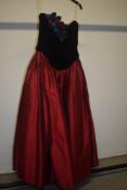 A vintage 'Ballard Calvert' dress having black velvet bodice with satin buttons to reverse, floral