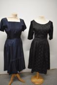 Two vintage 1950s dresses including blue taffeta dress with side metal zip and pleated insert to