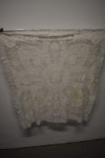 A vintage tulle and lace shawl or cloth having beautiful details throughout.