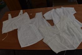 Four Victorian corset covers, all having intricate detailing throughout.