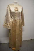A 1960s cream satin dress having amazing appliqué flowers that appear to 'open' which have silk