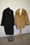 Two vintage faux fur coats, one brown the other blonde, medium to large sizes.