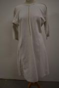 An antique French linen Chanvre biaude smock or shirt with singular button to neck and tiny hand