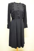 A late 1930s/ early 1940s medium weight wool day dress in navy blue, having gathered panels to