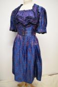 A late 1940s/50s iridescent dirndl dress of indigo, pink and green tones, having amazing details