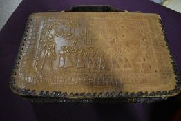A vintage embossed leather bag having Egyptian scenes, internal compartments and pockets and