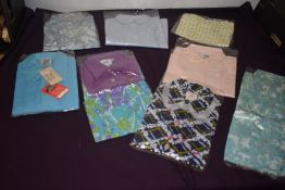 Eight vintage dead stock childrens blouses and tops, some lovely bright patterns.