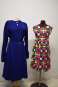 Two vintage dresses, to include late 1950s blue dress with belt in larger size and 1950s bright