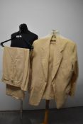 A gents vintage single breasted cream suit having button fly trousers.