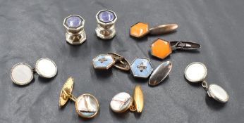 A pair of vintage yellow metal and glass maritime themed cuff-links, depicting yacht, sold