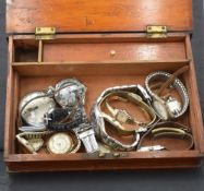 A vintage inlaid mahogany box having marquetry strap decoration and containing a selection of