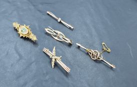 A group of five yellow metal 9ct gold bar brooches, 12grams gross.