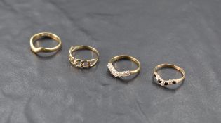 A 9ct gold diamond-set wishbone style ring, the seven diamond brilliants totalling 0.28cts, size H-
