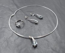A 14ct white gold necklace with matching ring and earrings, all having aqua marine and diamond