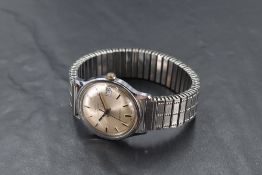 A gent's Timex automatic wrist watch having baton numeral dial and date aperture to silvered face in