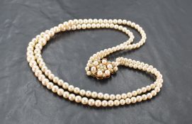 A double strand cultured pearl necklace, the two strands with graduating pearls and finishing with a